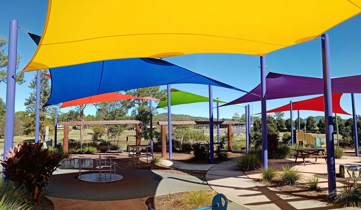 Different coloured shade sails at Hennessy Oval covering a playground