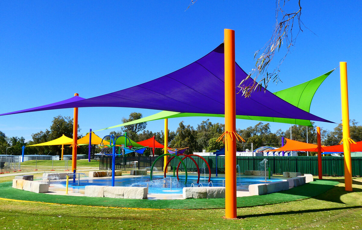 Different coloured shade sails at the Warren Sports Precincts covering a pool