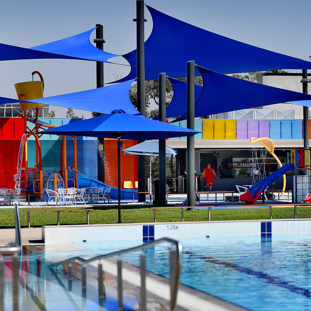 Gunnedah pool grounds covered with varying sizes and heights of blue hypar shade sails