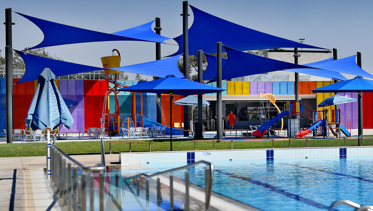 Gunnedah pool grounds covered with varying sizes and heights of blue hypar shade sails