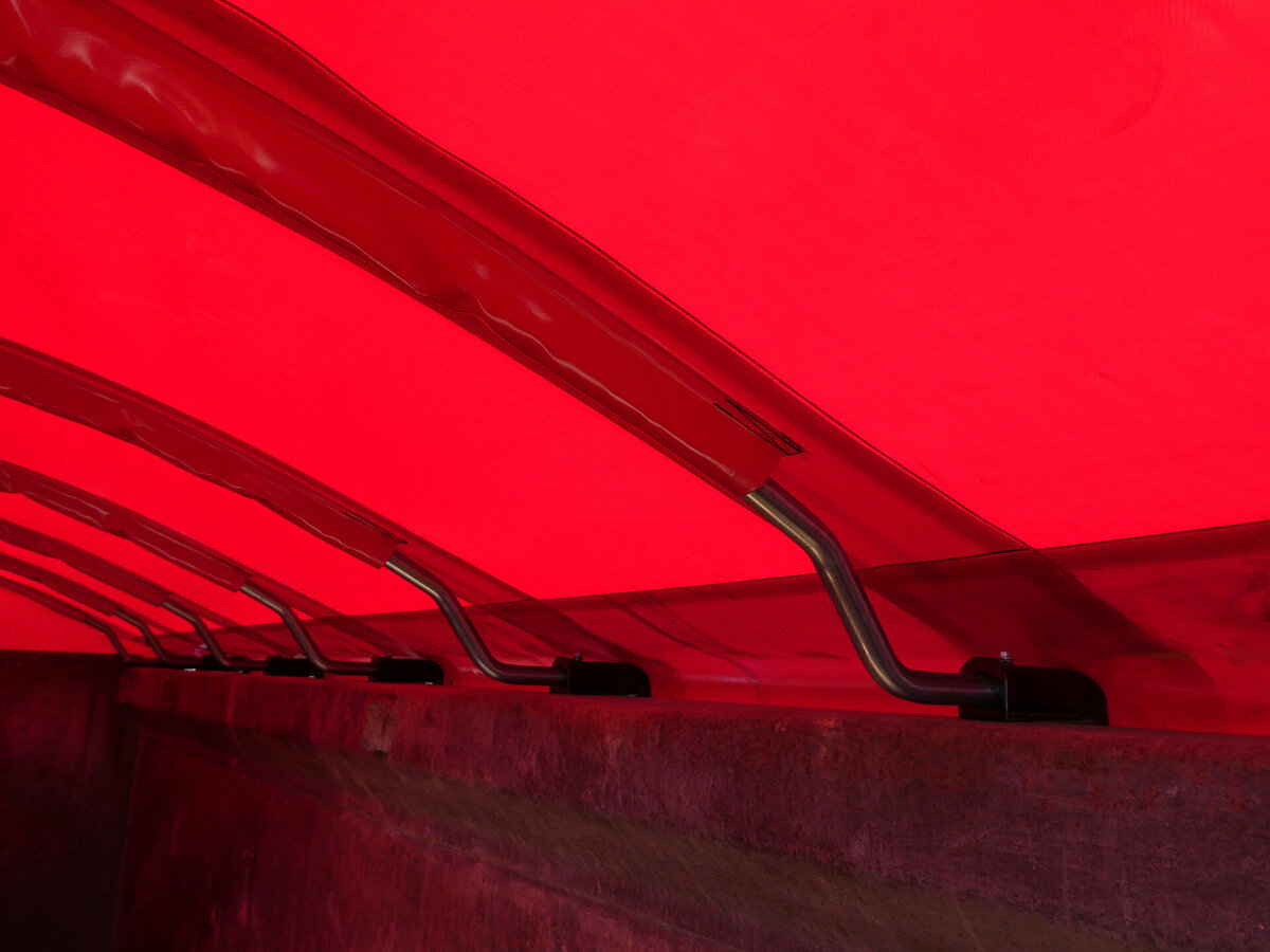 Inside look at a Tail-Wind retractable tarp on a truck trailer