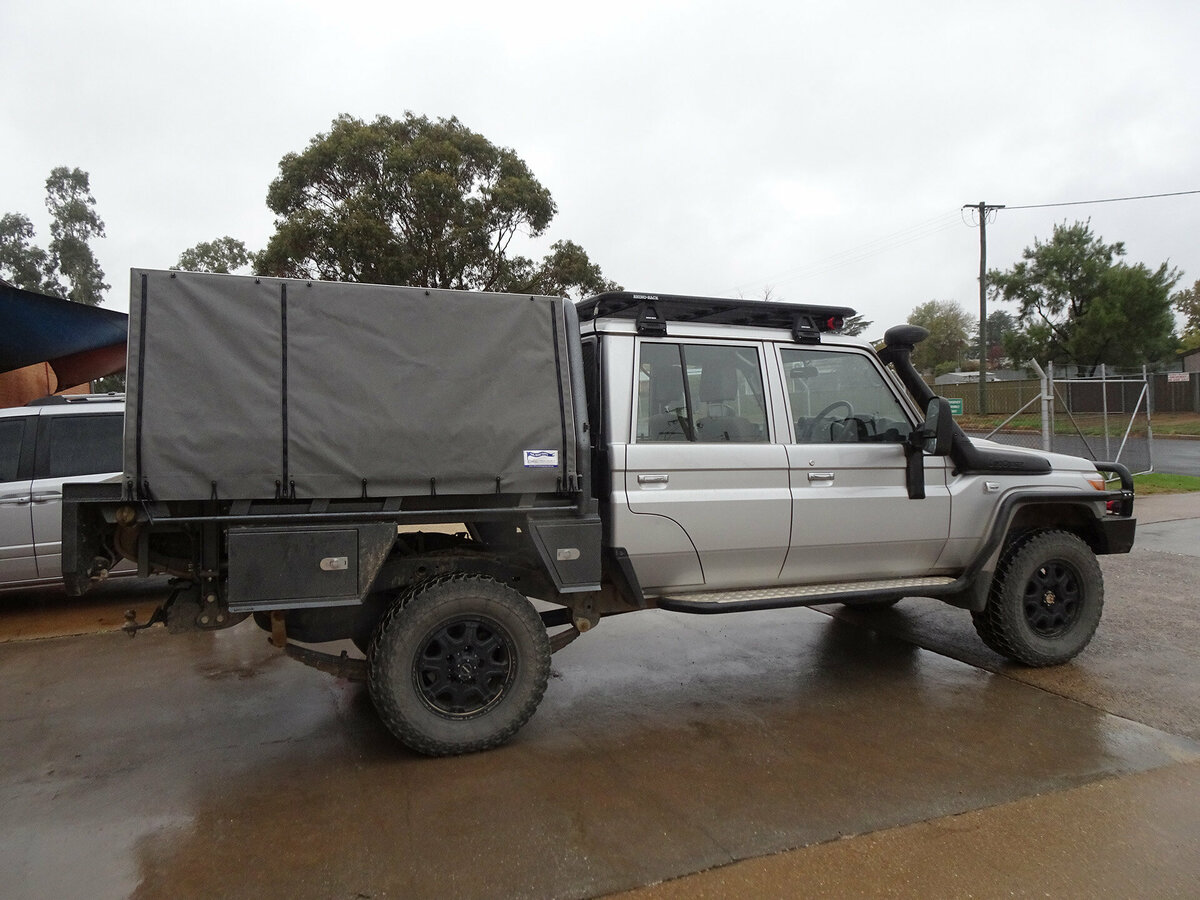 A ute with a grey canopy covering the tray