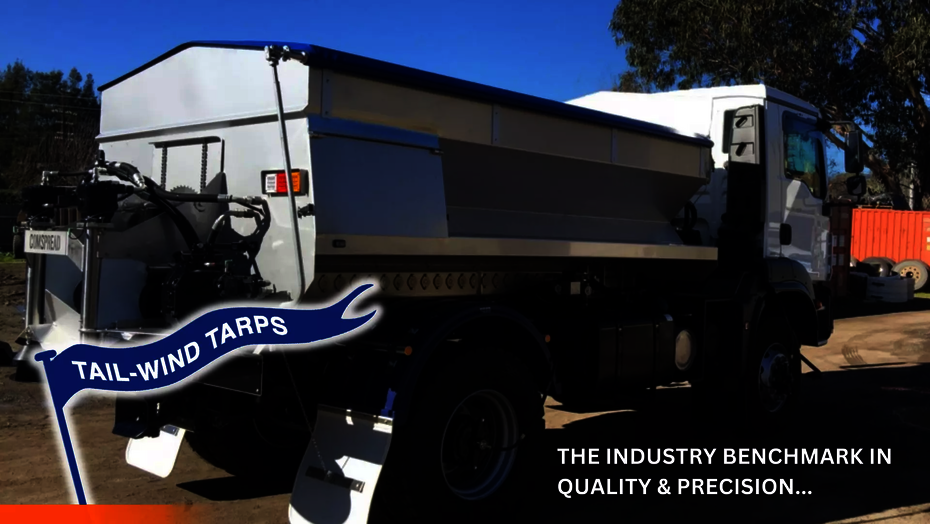A spreader bin with a roll-over tarp installed by Ellis and Sons Group.
