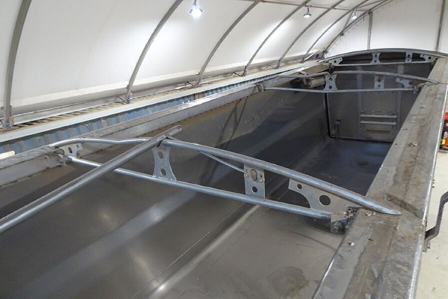 Roll-over tarp system steel bows that were damaged by overloaded cotton seed.