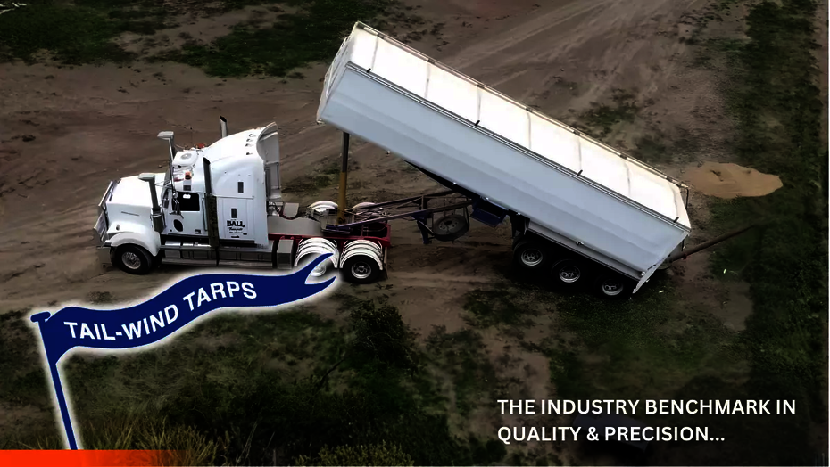 A tipper truck with a roll-top tarp installed by Tail-Wind Tarps, Ellis and Sons Group.