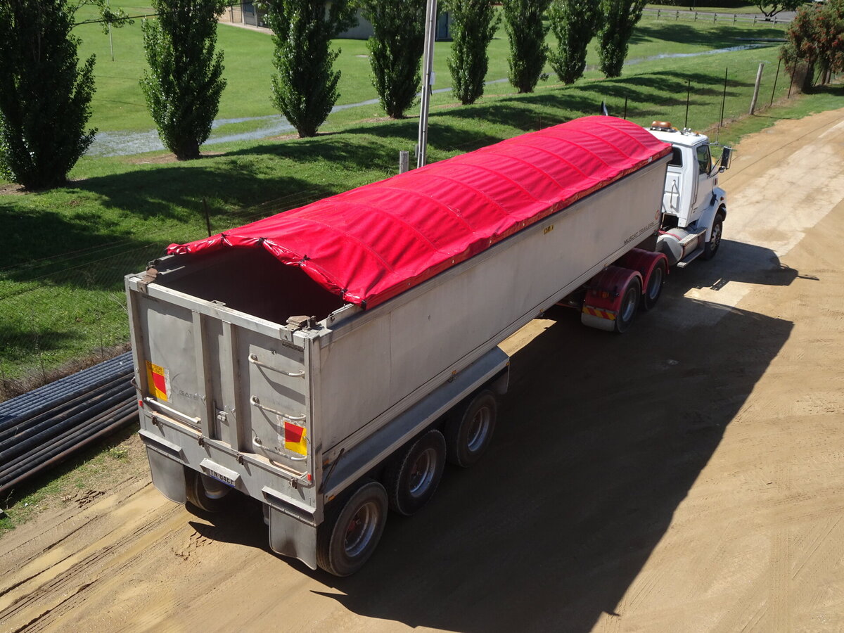 An Ellis and Sons Group retractable tarp cover for a semi-trailer of Whitechurch Farm, Grenfell NSW