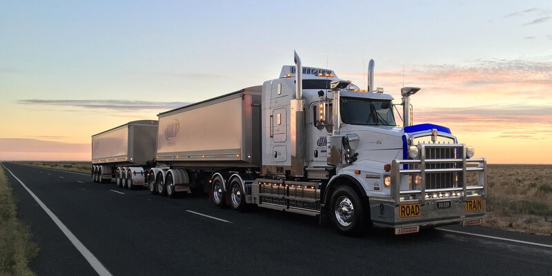 A David Knight Transport truck with a roll-over tarp from Ellis and Sons Group
