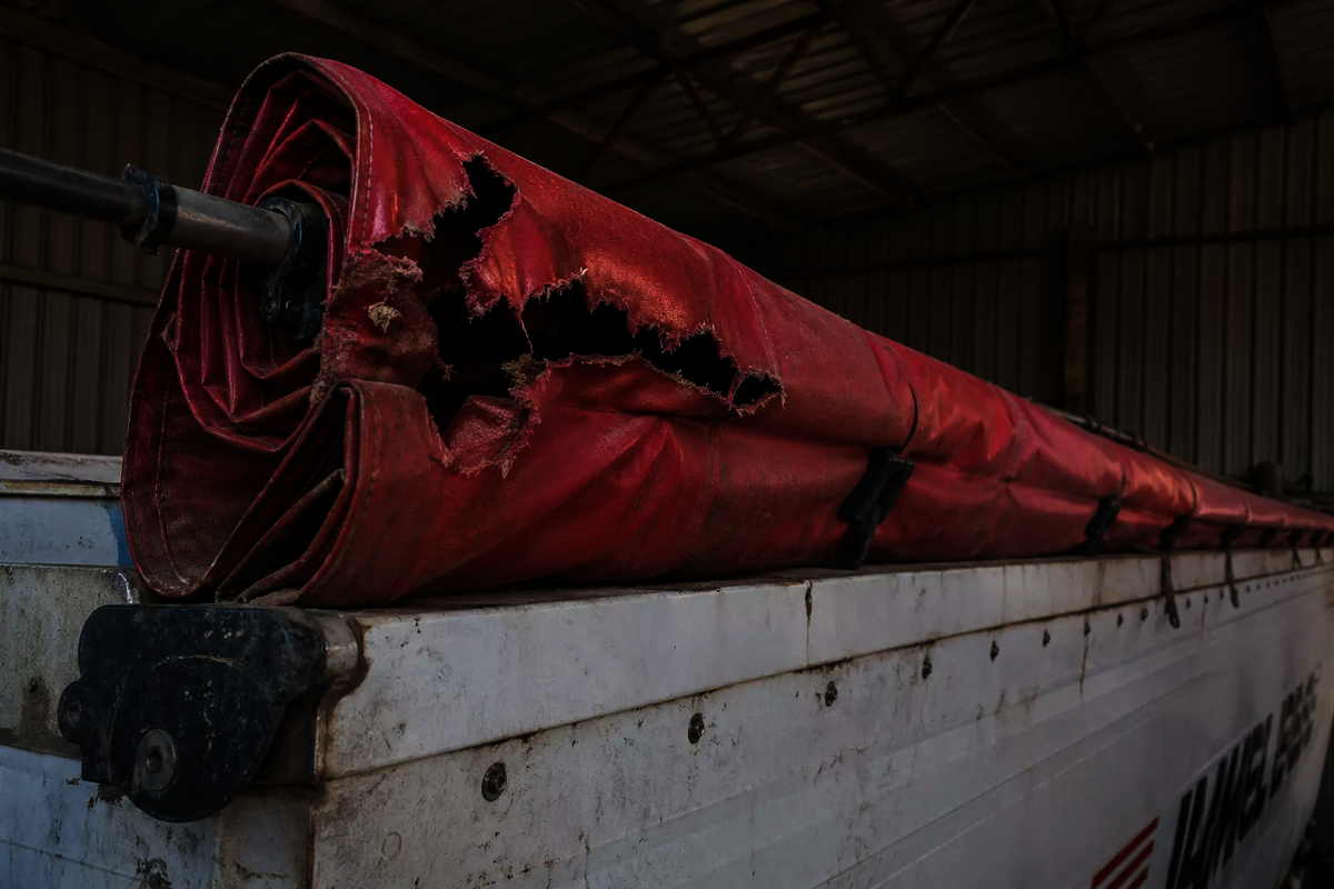 A roll-over tarp with holes chewed threw it by rodents