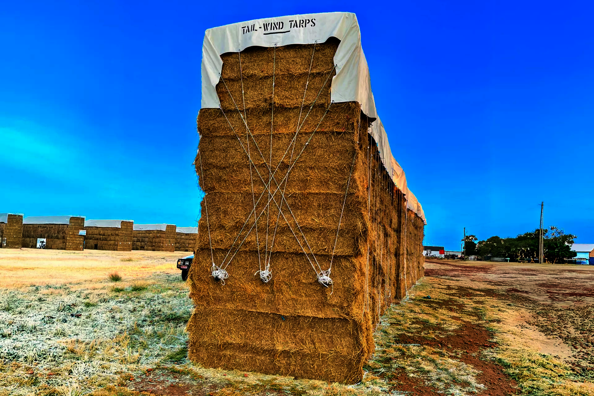 A hay cover with eyelets and bungee made for Matilda Grazing by Ellis and Sons Group