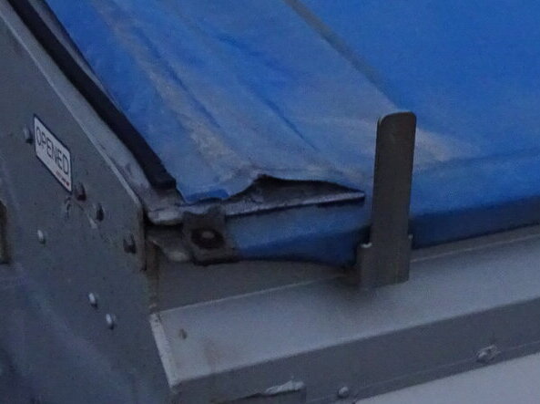 A tear in an old roll-over tarp of Brendan Nash that was replaced by Ellis and Sons Group.